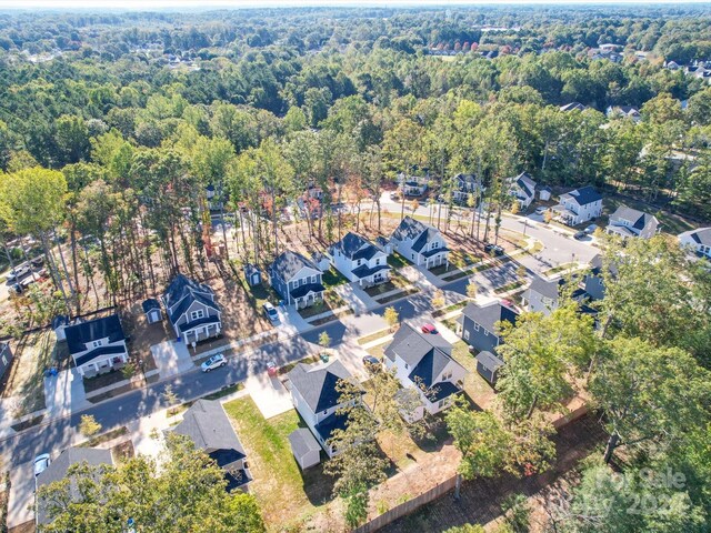 bird's eye view with a view of trees and a residential view