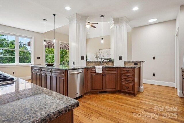 kitchen featuring a sink, baseboards, dishwasher, light wood finished floors, and a ceiling fan