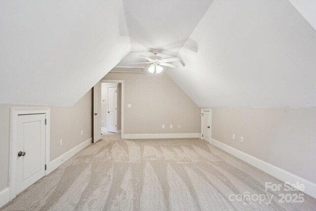 bonus room featuring baseboards, ceiling fan, lofted ceiling, and light colored carpet