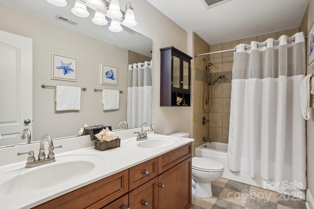 full bath with shower / bath combo, visible vents, toilet, and a sink