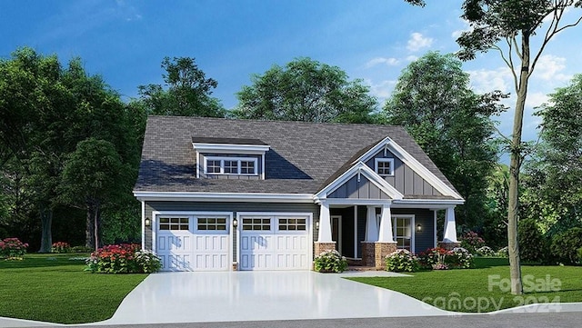 view of front of home with a garage, a porch, and a front lawn