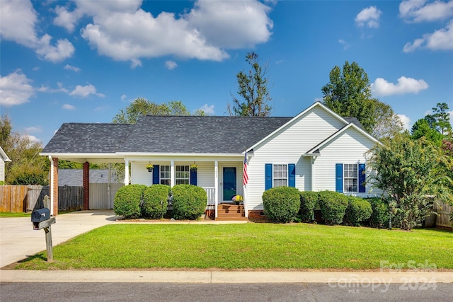 single story home featuring a porch and a front lawn