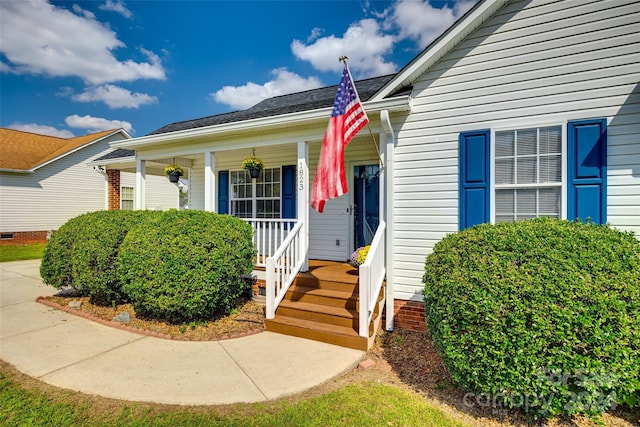 property entrance featuring covered porch