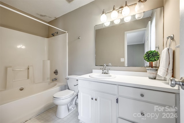 full bathroom with a textured ceiling,  shower combination, vanity, and toilet