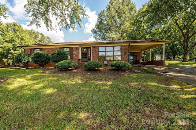 ranch-style home featuring a front yard and a carport