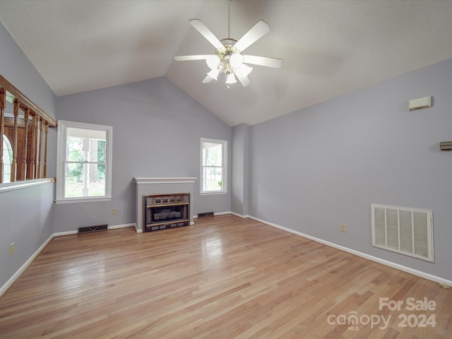 unfurnished living room with light hardwood / wood-style flooring, lofted ceiling, and ceiling fan