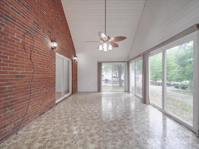 unfurnished sunroom featuring lofted ceiling and ceiling fan