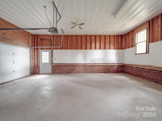 garage featuring a garage door opener and ceiling fan