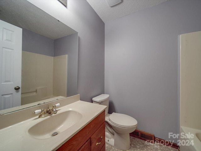 full bathroom featuring a textured ceiling, independent shower and bath, vanity, and toilet