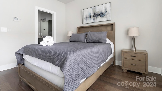 bedroom featuring dark wood-type flooring