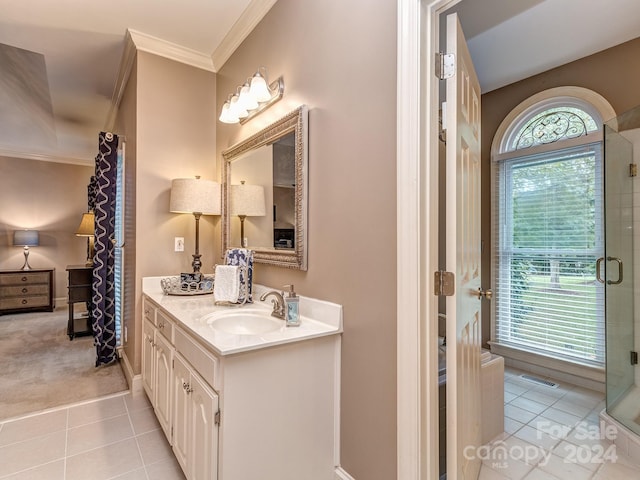 bathroom with crown molding, tile patterned flooring, vanity, and an enclosed shower