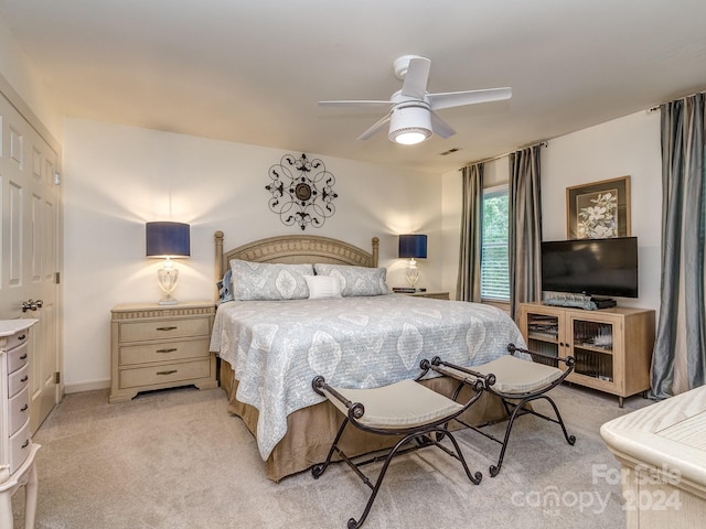 carpeted bedroom with ceiling fan