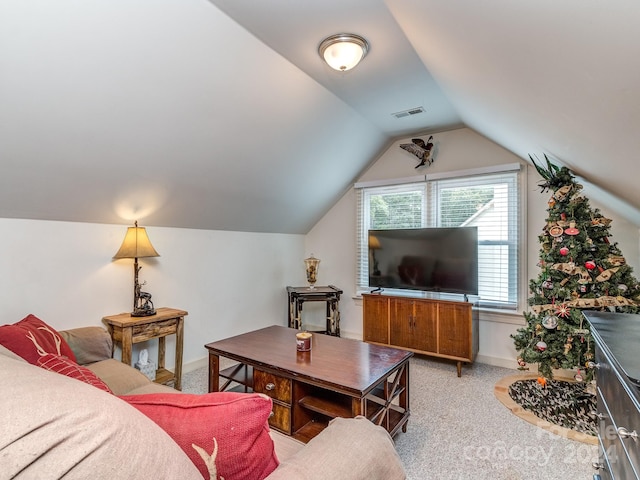 living room with lofted ceiling and light carpet