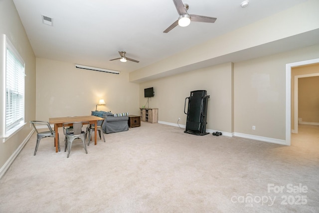 interior space featuring ceiling fan, a healthy amount of sunlight, and light carpet