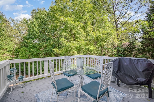 wooden terrace featuring grilling area