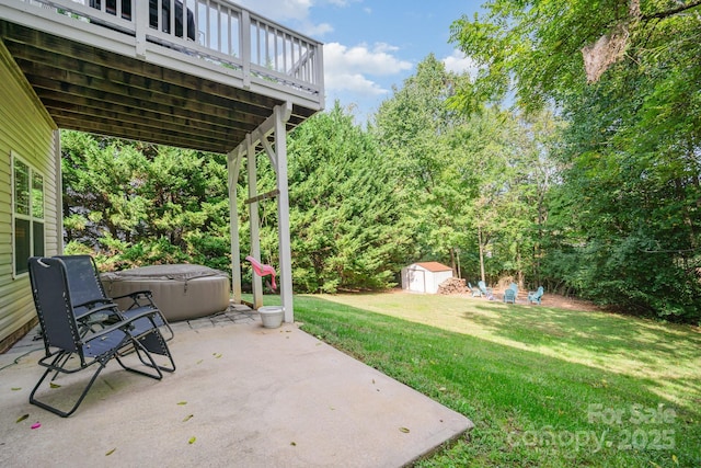 view of patio featuring a shed, a wooden deck, and a hot tub