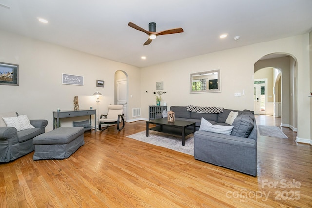121 Canvasback Rd, Mooresville, NC 28117 - living room with arched walkways, light wood-type flooring, ceiling fan, and recessed lighting