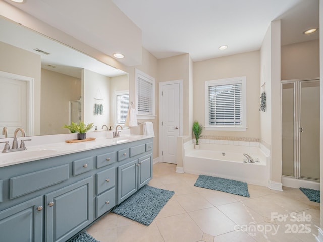 121 Canvasback Rd, Mooresville, NC 28117 - full bathroom featuring a bath, double vanity, a shower stall, tile patterned floors, and recessed lighting