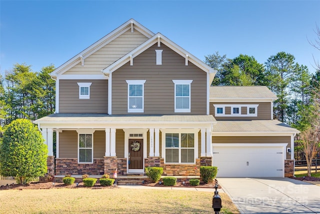 craftsman-style house with a garage and covered porch