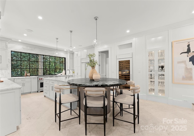 dining room featuring sink and beverage cooler