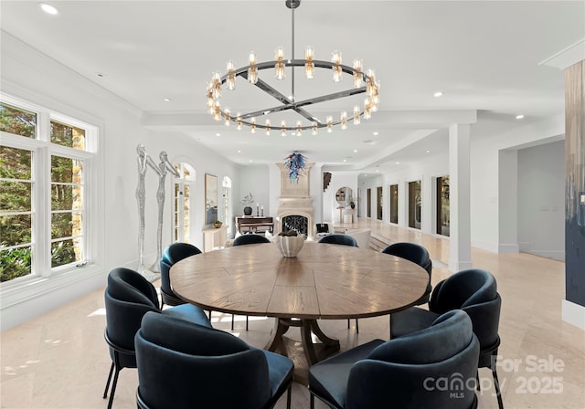 dining room with a healthy amount of sunlight and a notable chandelier