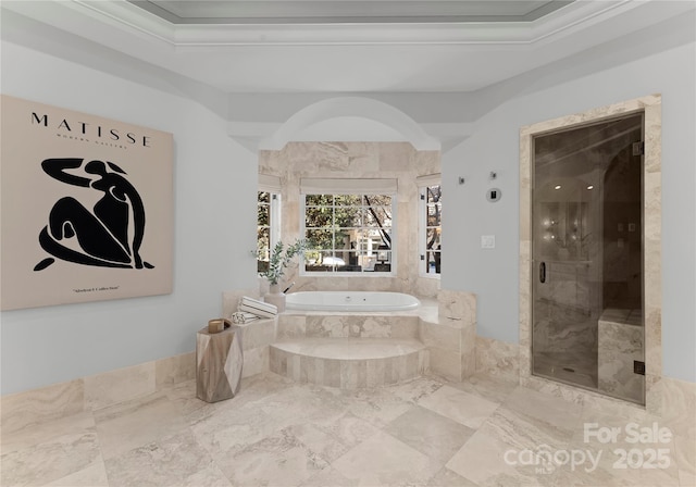 bathroom featuring ornamental molding, plus walk in shower, and a raised ceiling