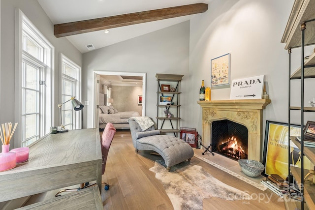 living room with wood-type flooring and lofted ceiling with beams