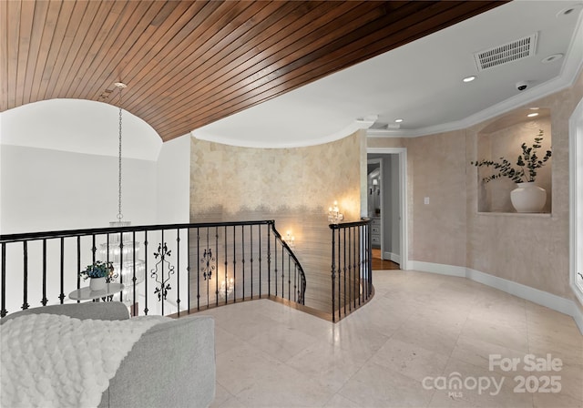 hall featuring crown molding and wood ceiling