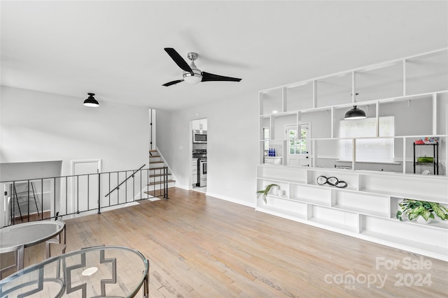 interior space featuring ceiling fan and hardwood / wood-style flooring