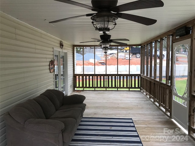 sunroom / solarium with ceiling fan