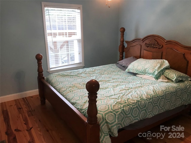 bedroom featuring hardwood / wood-style flooring