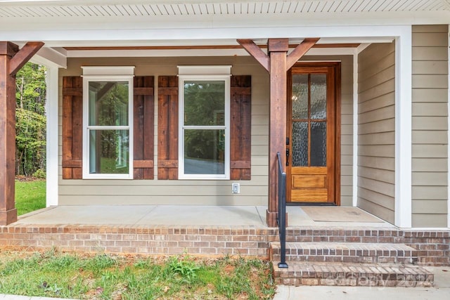 doorway to property with a porch