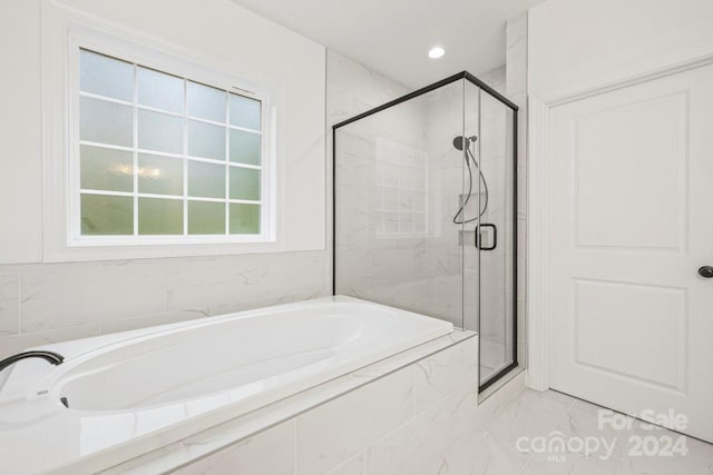 bathroom featuring plus walk in shower