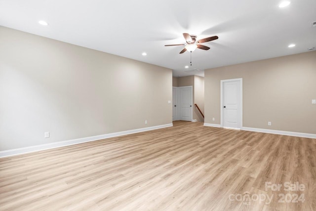 unfurnished room with light hardwood / wood-style flooring and ceiling fan