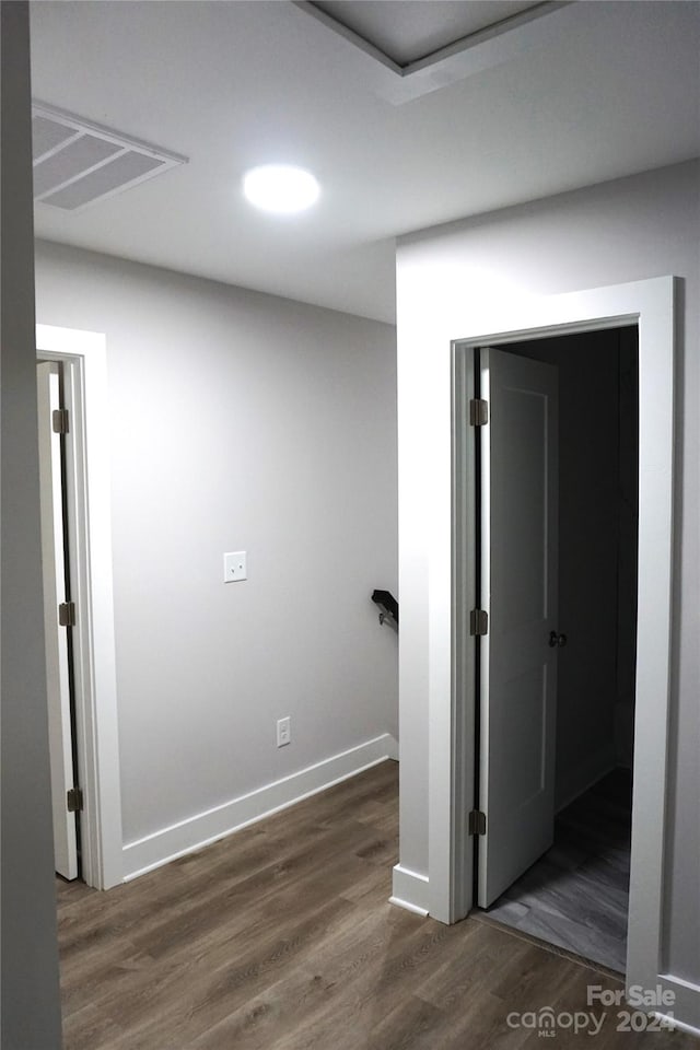 hallway featuring dark wood-type flooring