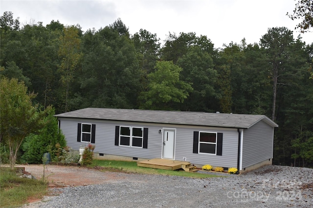 manufactured / mobile home featuring a wooden deck