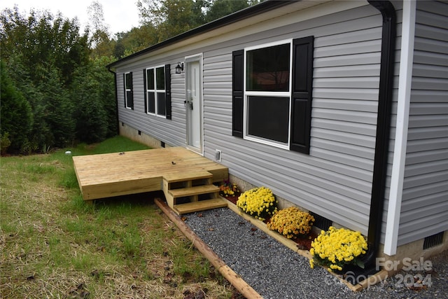 view of side of home featuring a deck