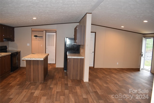 kitchen featuring a center island, black appliances, a textured ceiling, and dark hardwood / wood-style floors