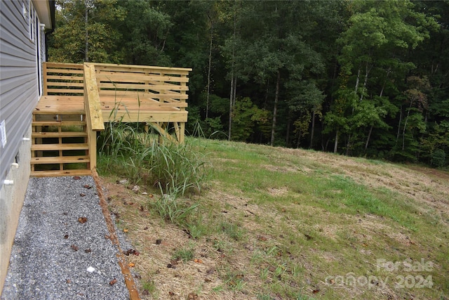 view of yard featuring a wooden deck