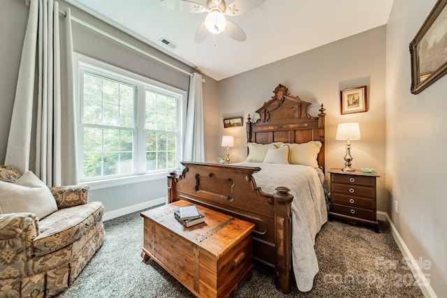 bedroom with dark colored carpet and ceiling fan