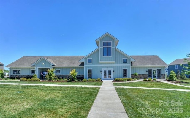 view of front facade featuring french doors and a front yard