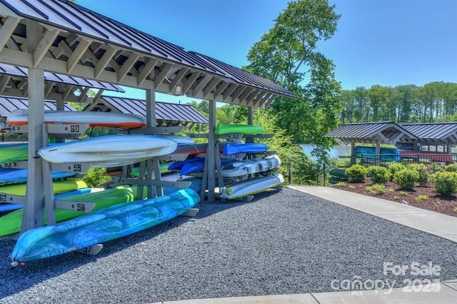 view of vehicle parking featuring a playground