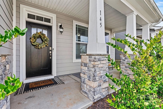 doorway to property with a porch