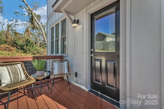 doorway to property featuring a deck