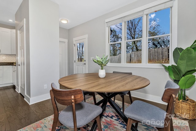 dining area featuring dark hardwood / wood-style flooring