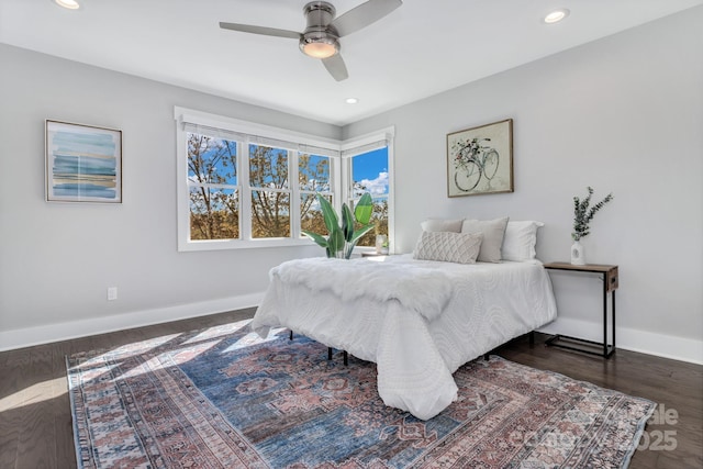 bedroom featuring ceiling fan and dark hardwood / wood-style floors