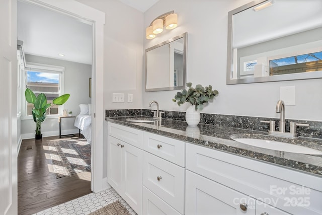 bathroom with tile patterned floors and vanity