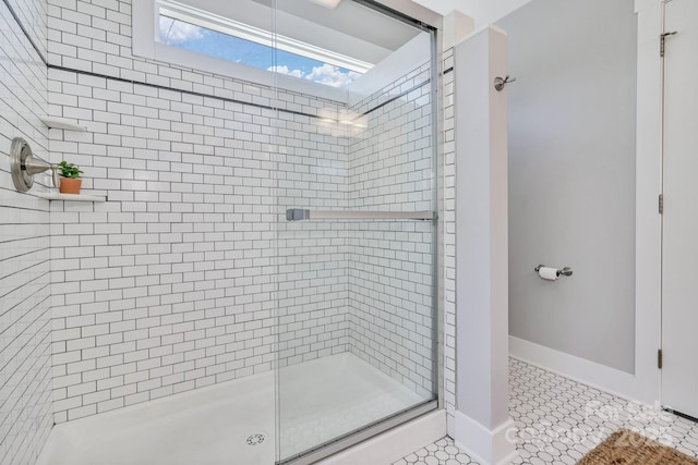 bathroom featuring tile patterned floors and an enclosed shower