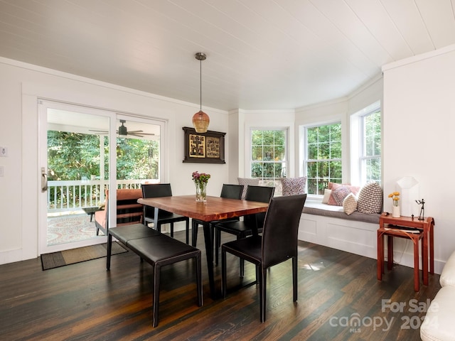 dining space featuring dark hardwood / wood-style flooring, ceiling fan, and ornamental molding