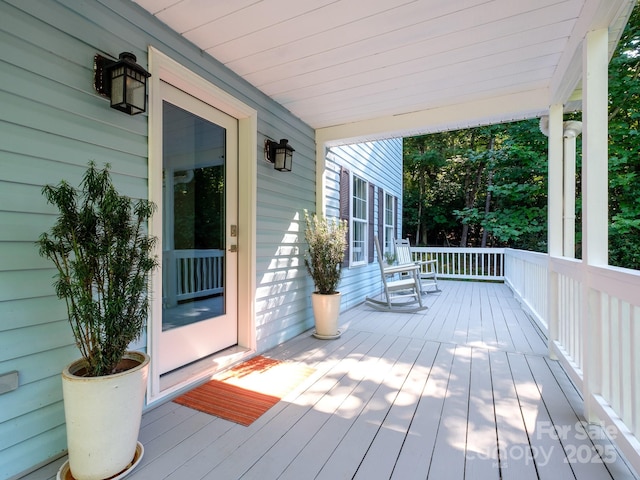 wooden deck featuring covered porch